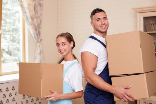 Loading household furniture into a removals van in Haringey
